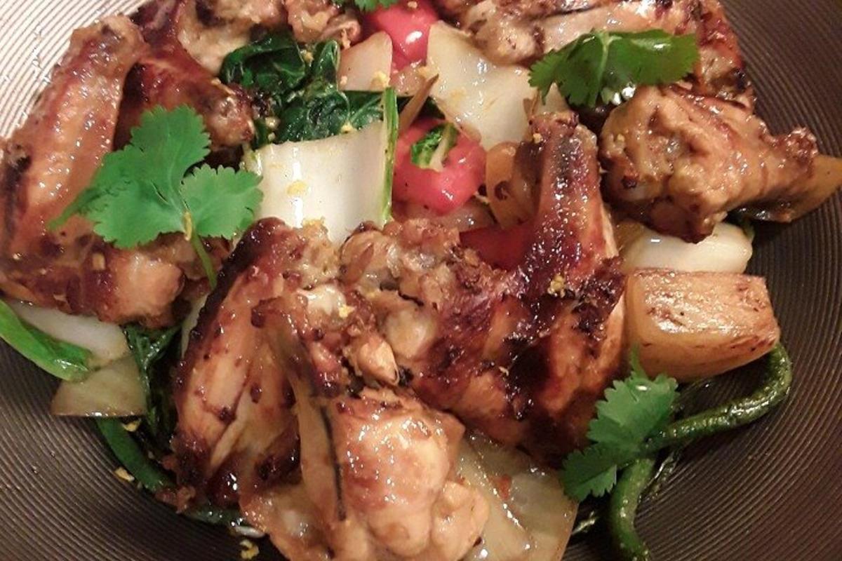 a plate of food with meat and vegetables