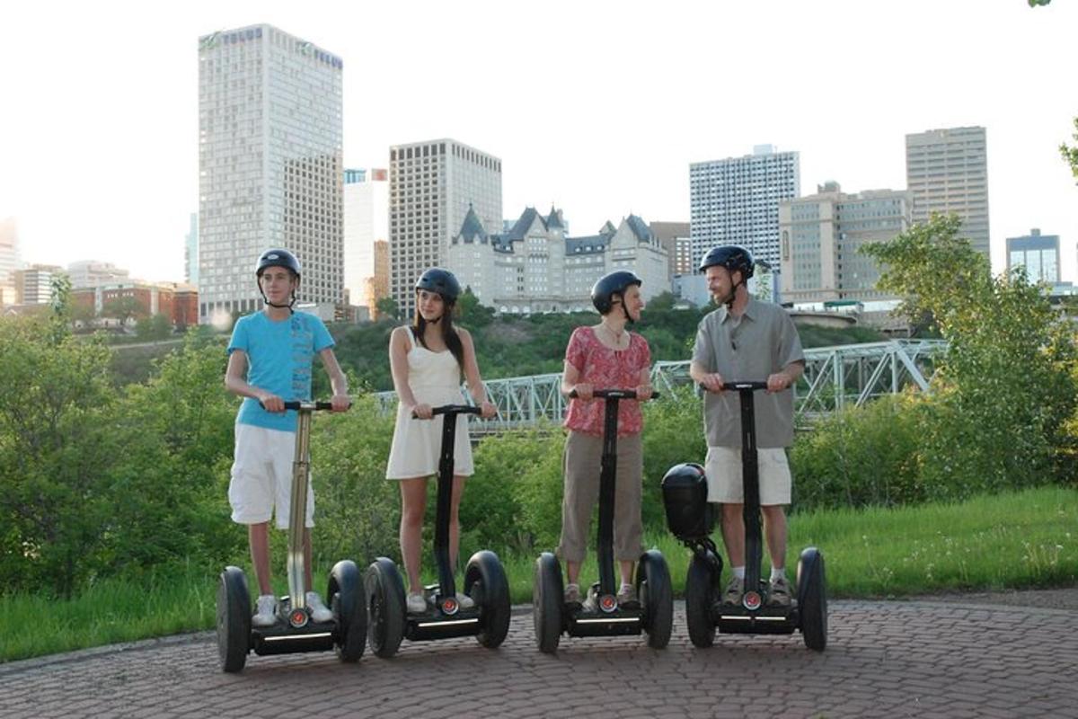 a group of four people riding on scooters