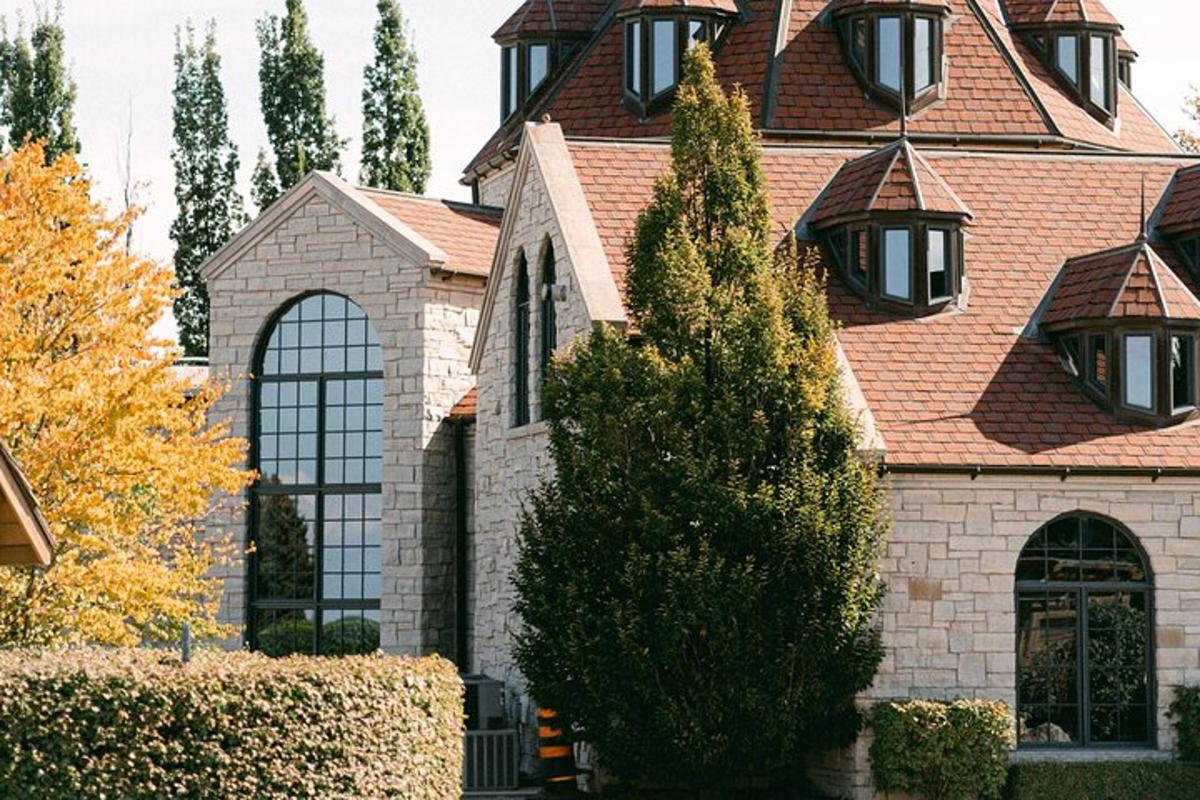 a brick house with a roof with lights on it