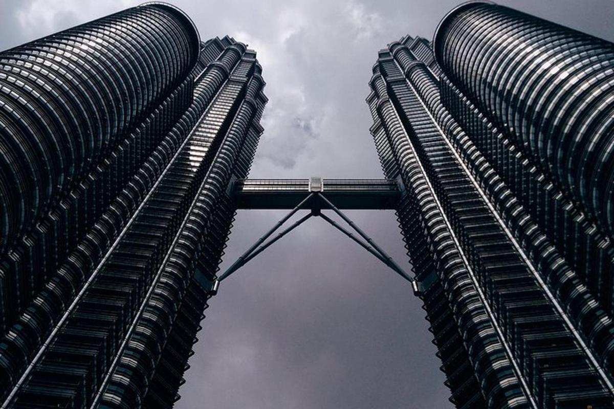 two tall buildings standing next to each other