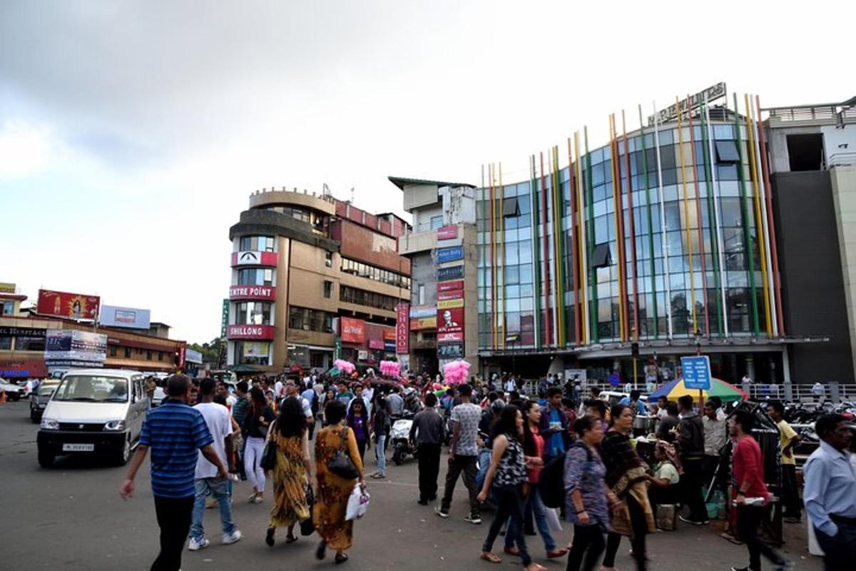 a large crowd of people walking down a city street
