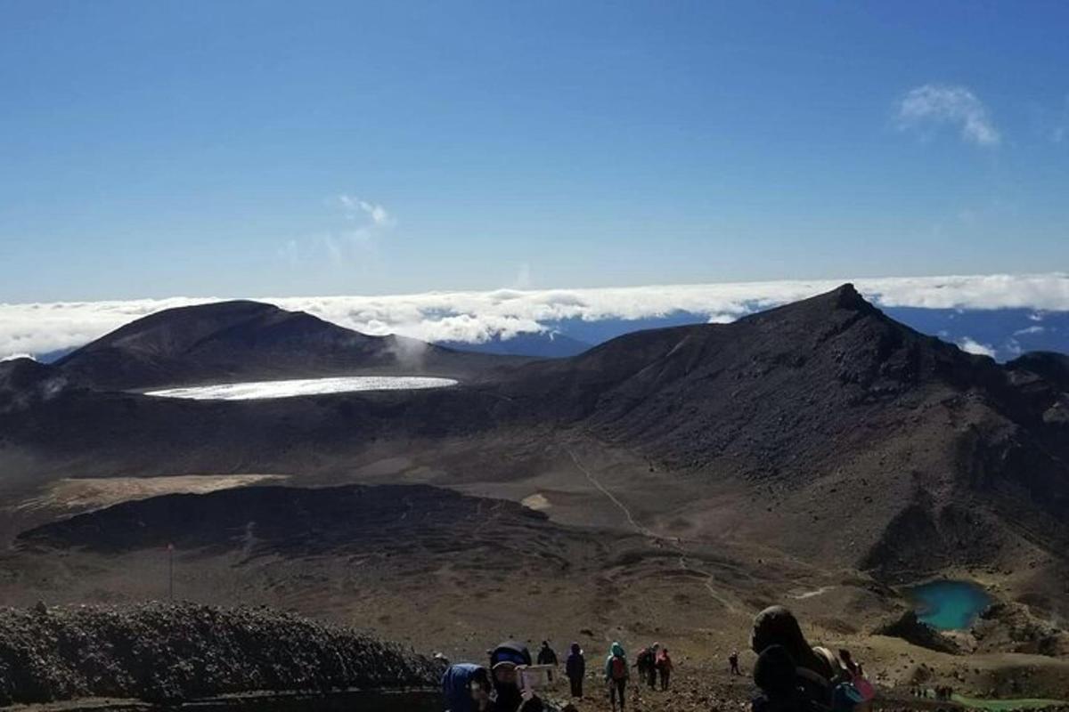 a group of people standing on top of a mountain