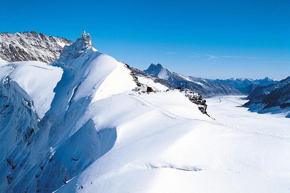 a view of a mountain with snow on it
