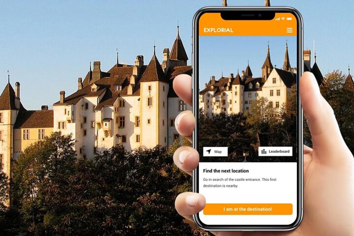 a person holding up a cell phone in front of a castle