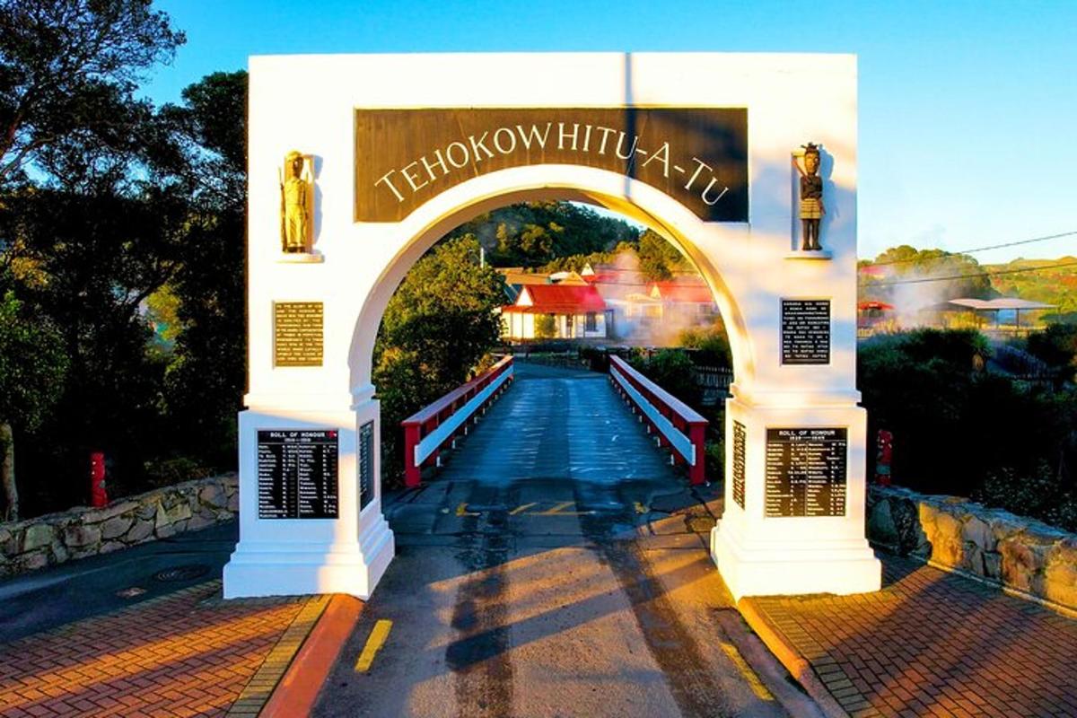 an archway leading to a water park with a sign