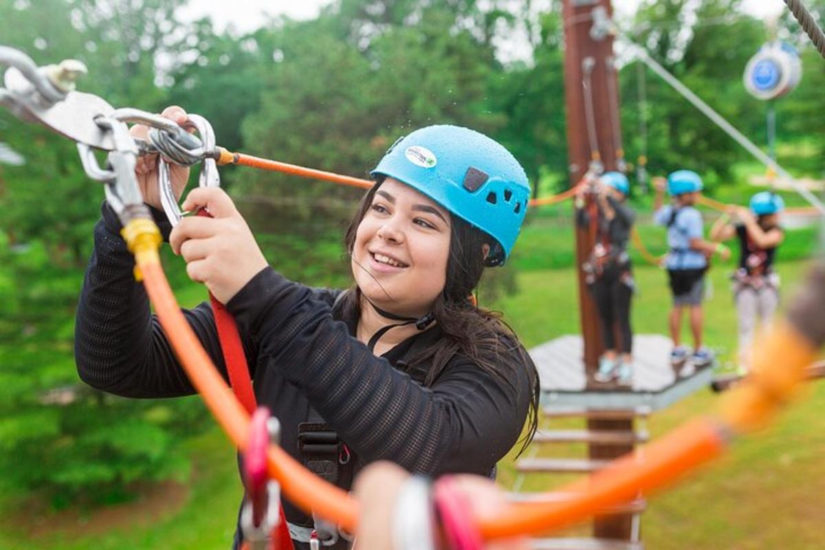 a girl is on a zip line