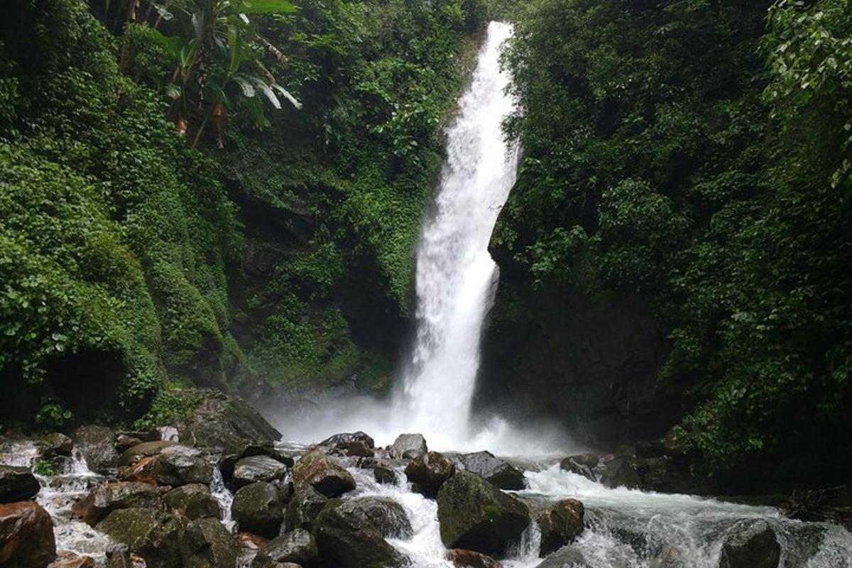 a waterfall in the middle of a river