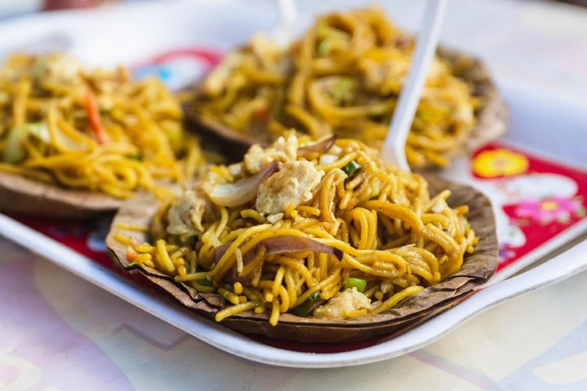 a plate of food with noodles on a table