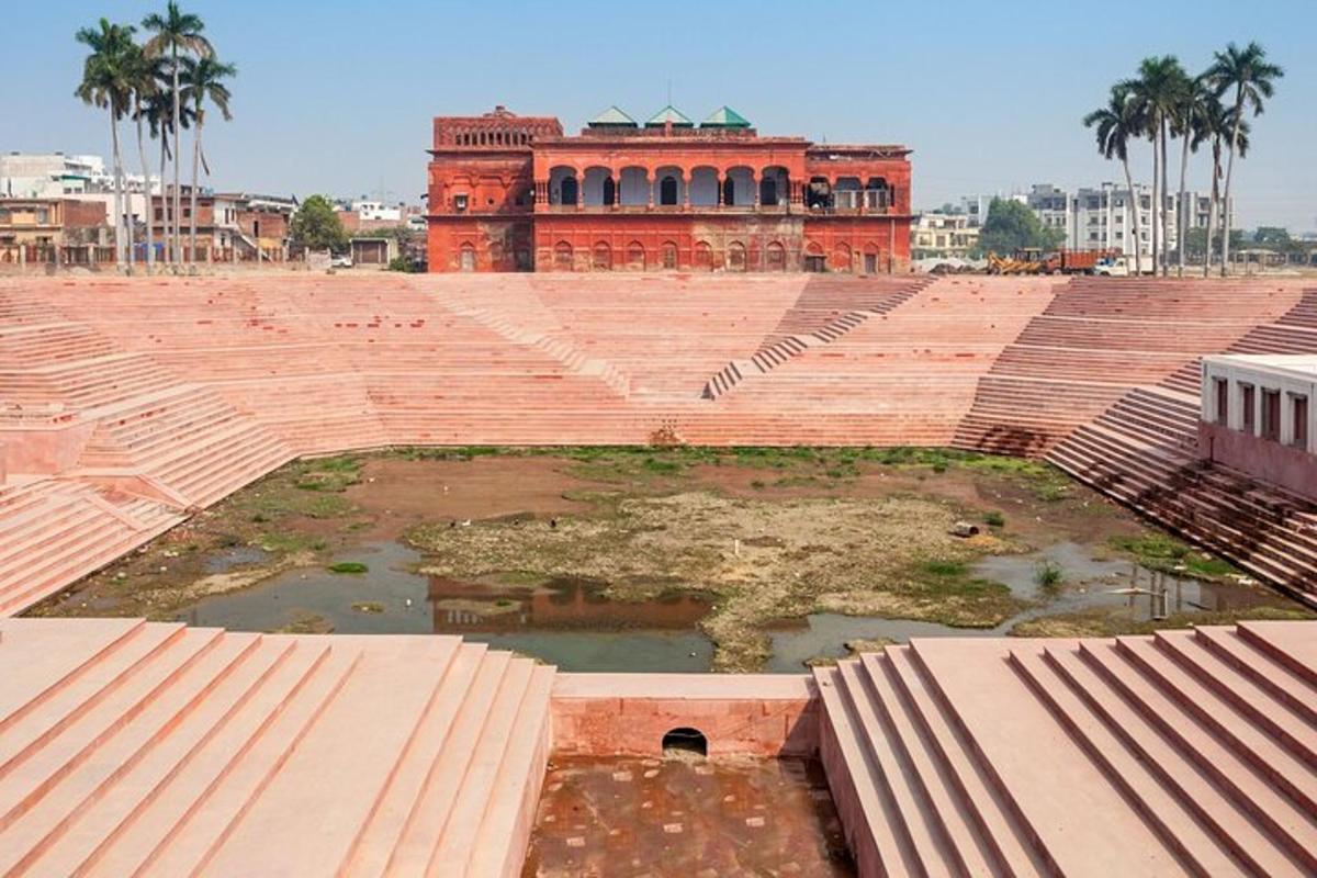a large amphitheater with a building in the background