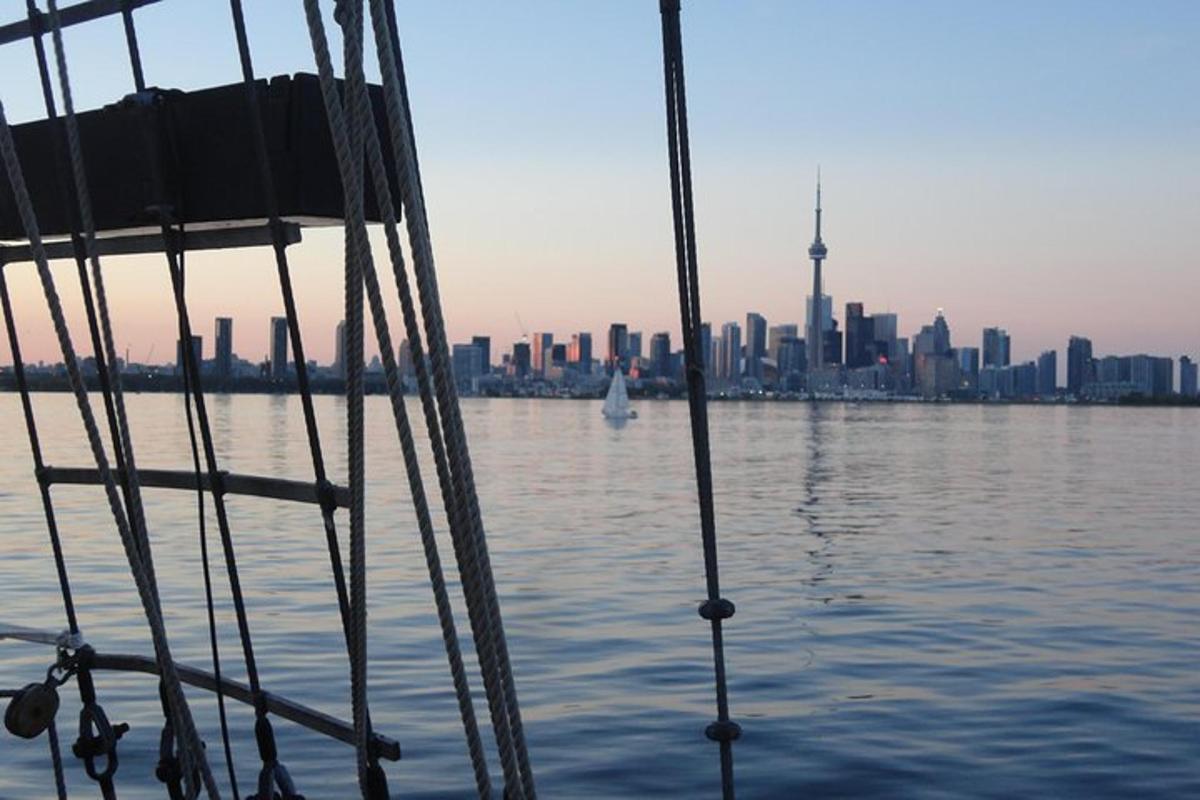 a boat in the water with a view of the city