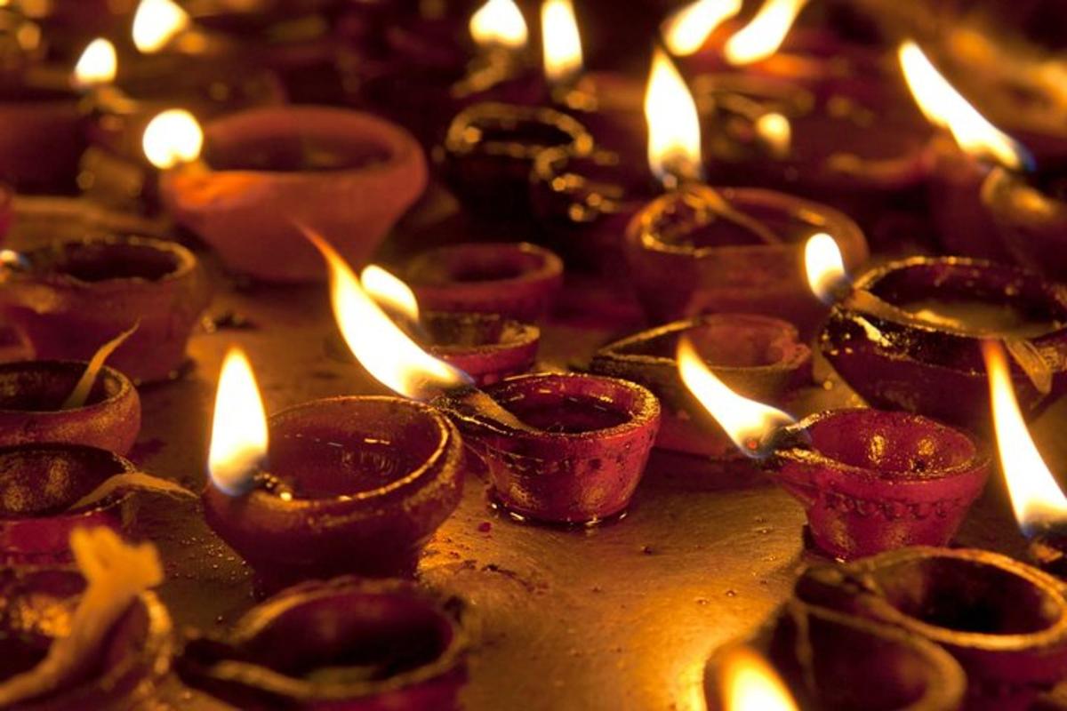 a group of lit candles on a table