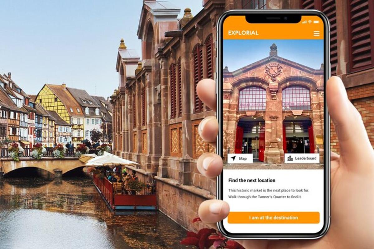 a person taking a picture of a canal with a cell phone