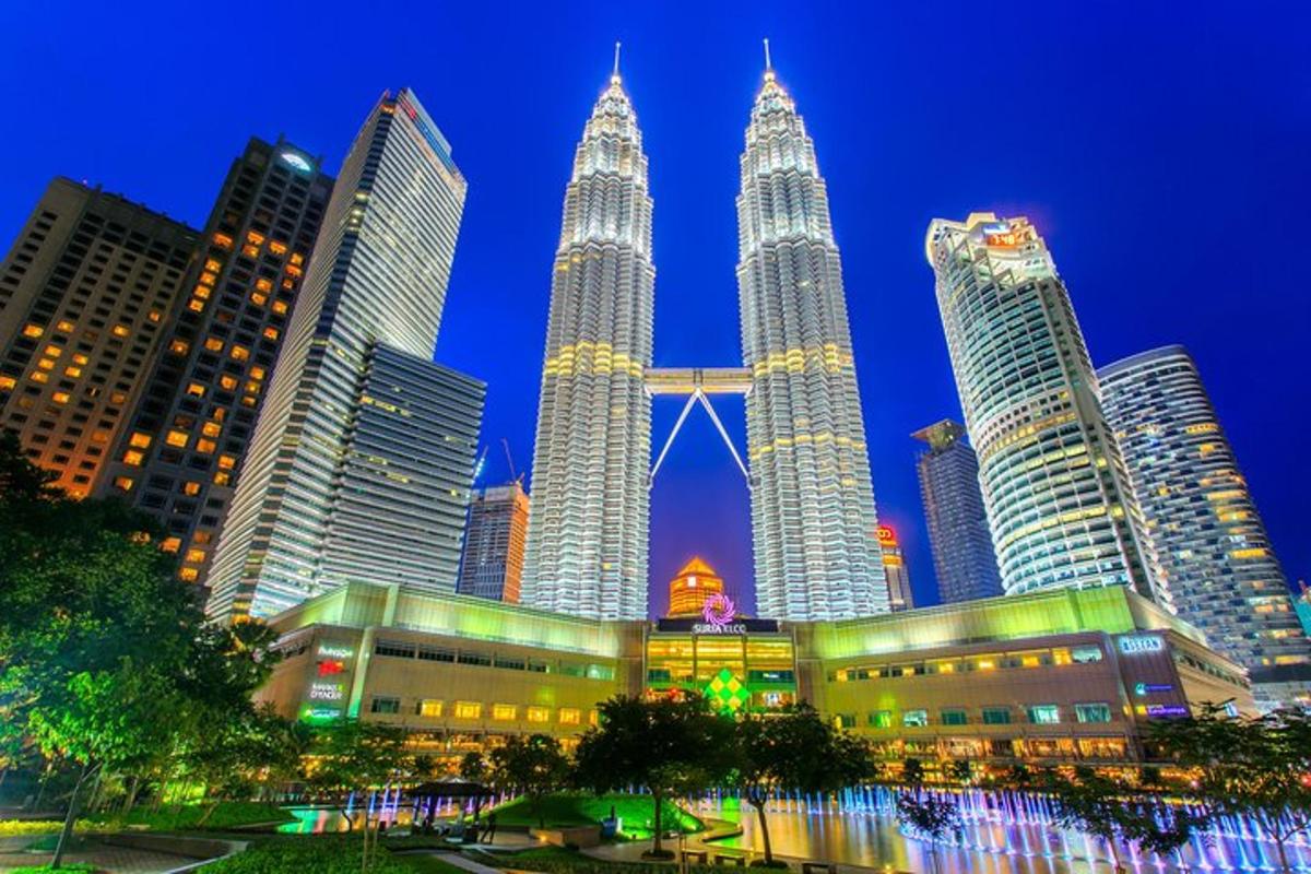 a group of tall skyscrapers in a city at night