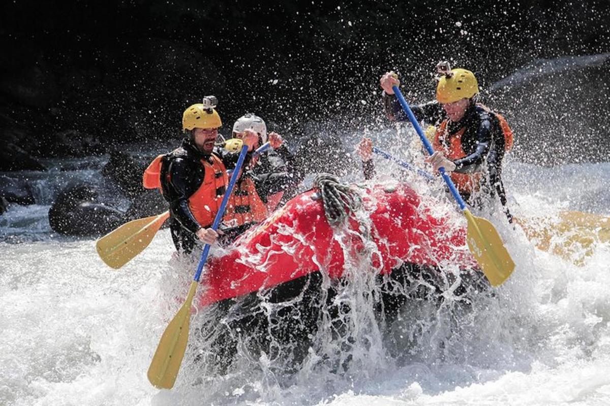 a group of people on a raft in the water