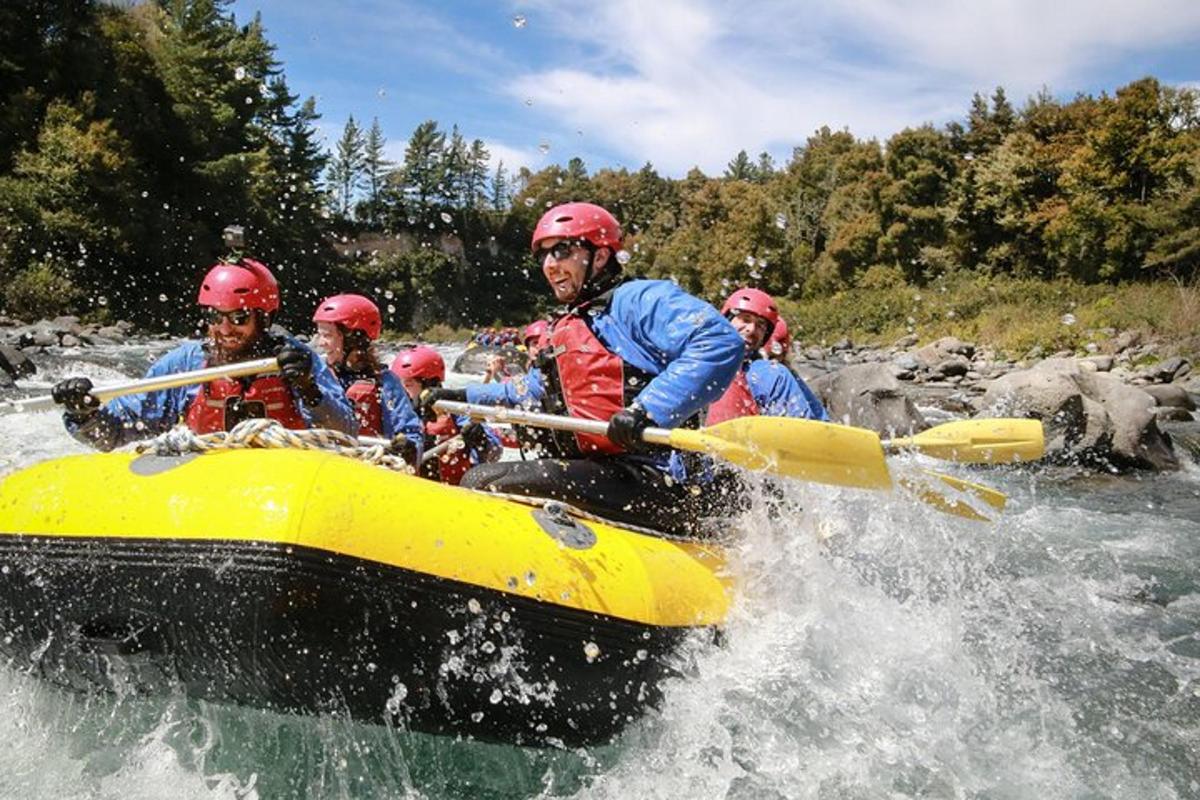 a group of people in a raft on a river