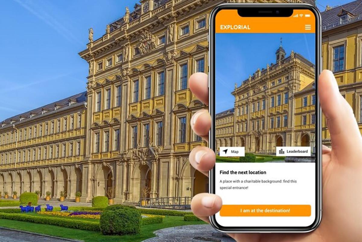 a person holding up a cell phone in front of a building