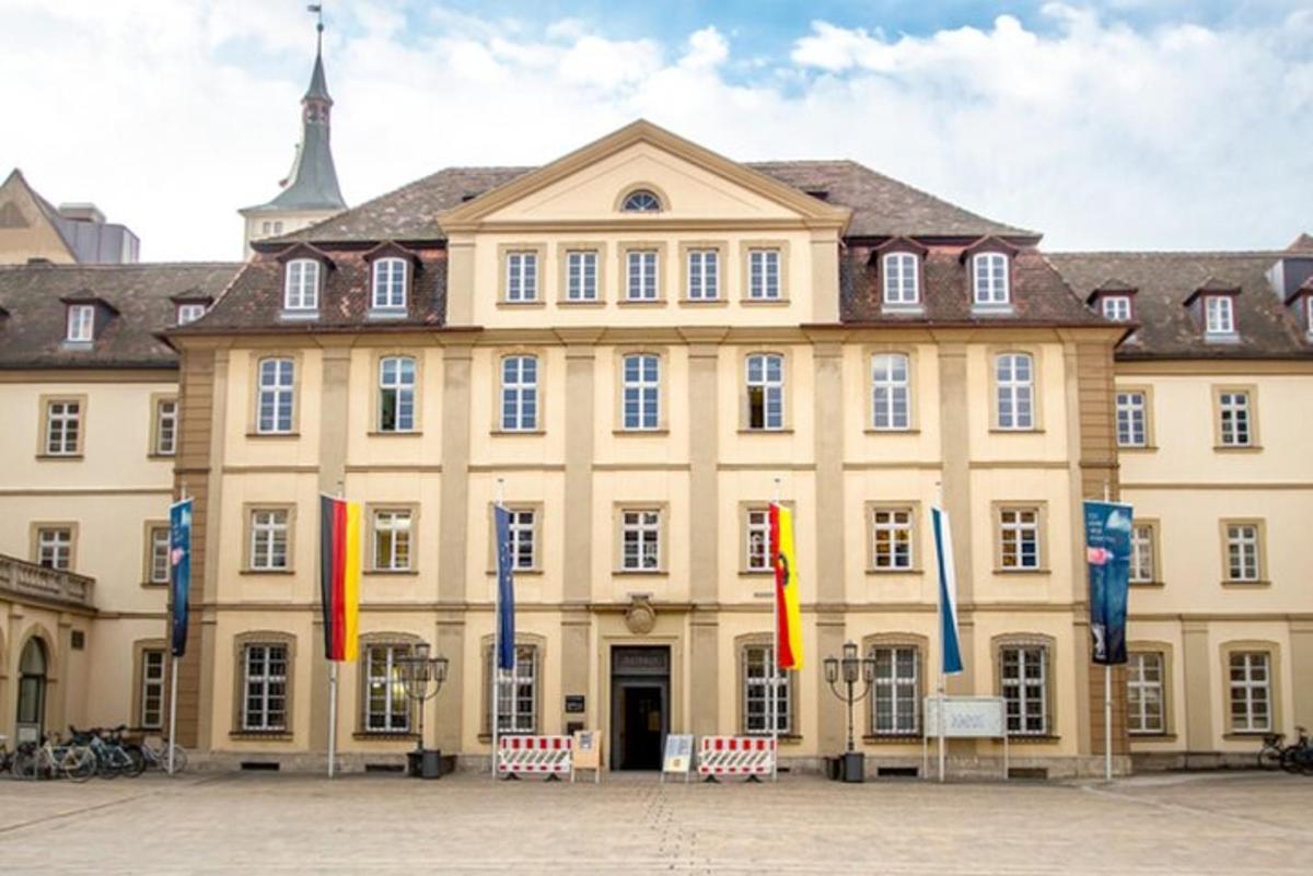 a large building with flags in front of it