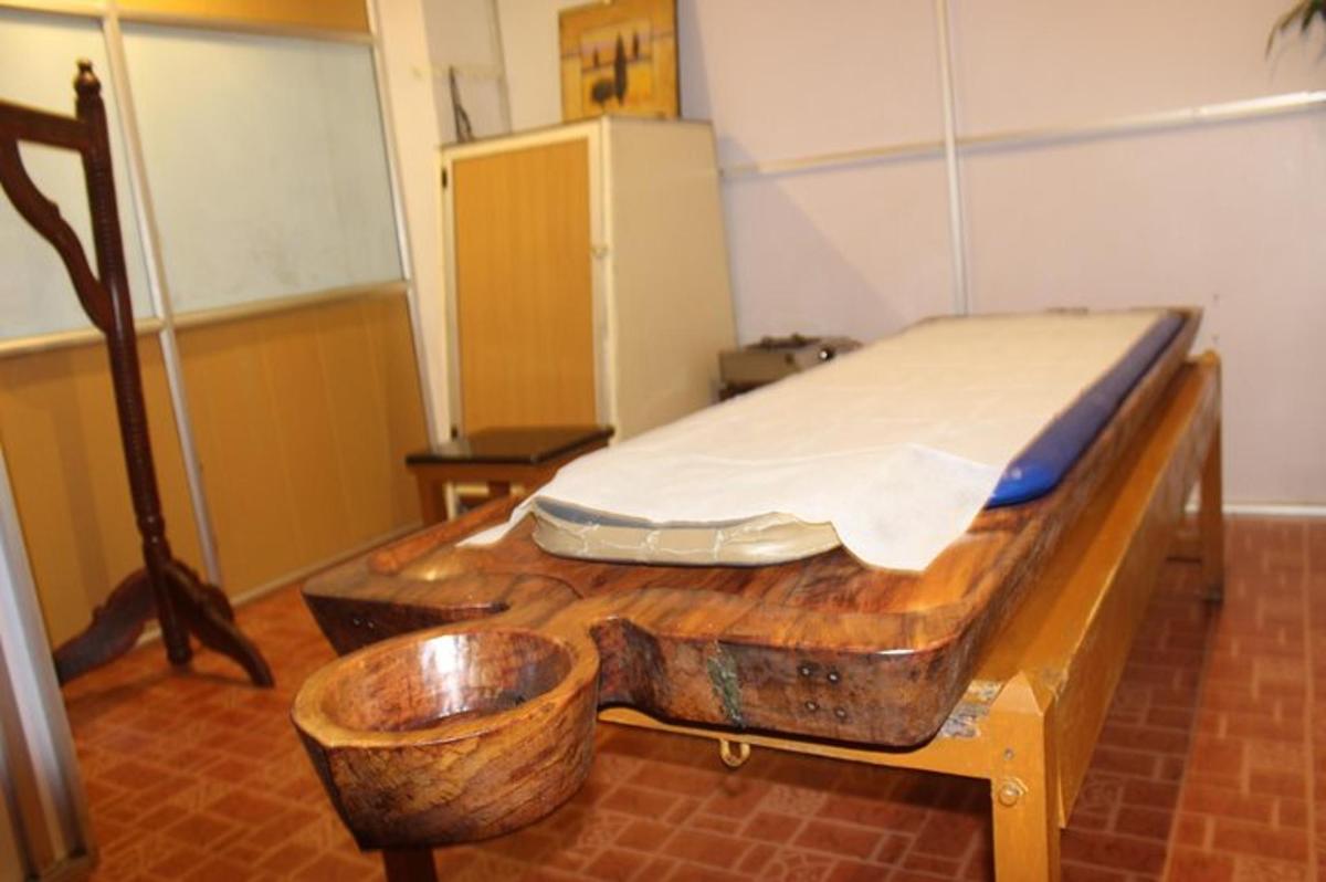 a room with a bed on a wooden table
