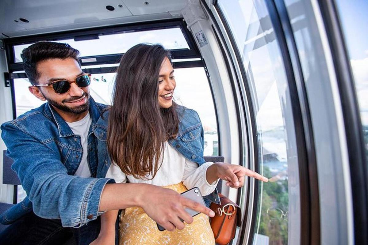 a man and woman on a train looking out the window