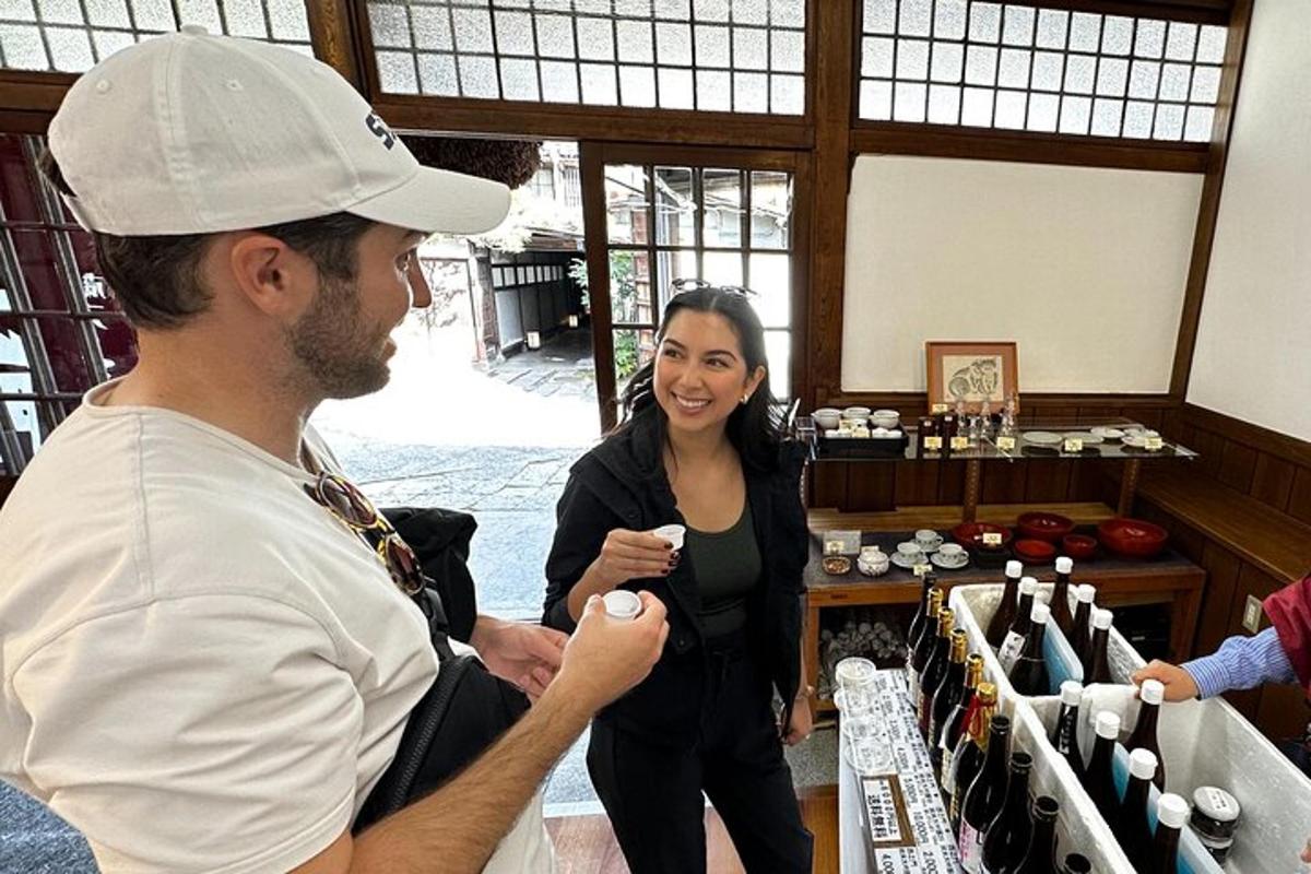 a woman standing next to a man in a wine shop