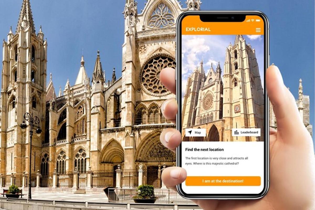 a person holding up a cell phone in front of a cathedral