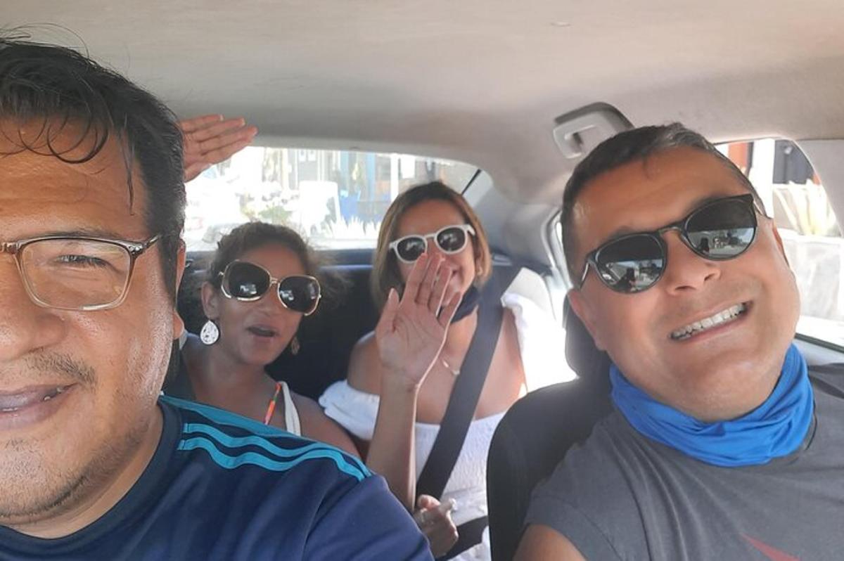 a group of people sitting in the back of a car