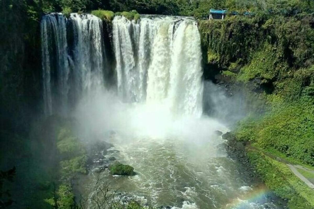 a large waterfall in the middle of a river
