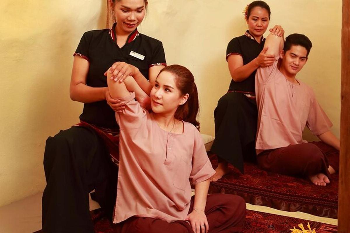 a woman getting her hair dried in front of a mirror