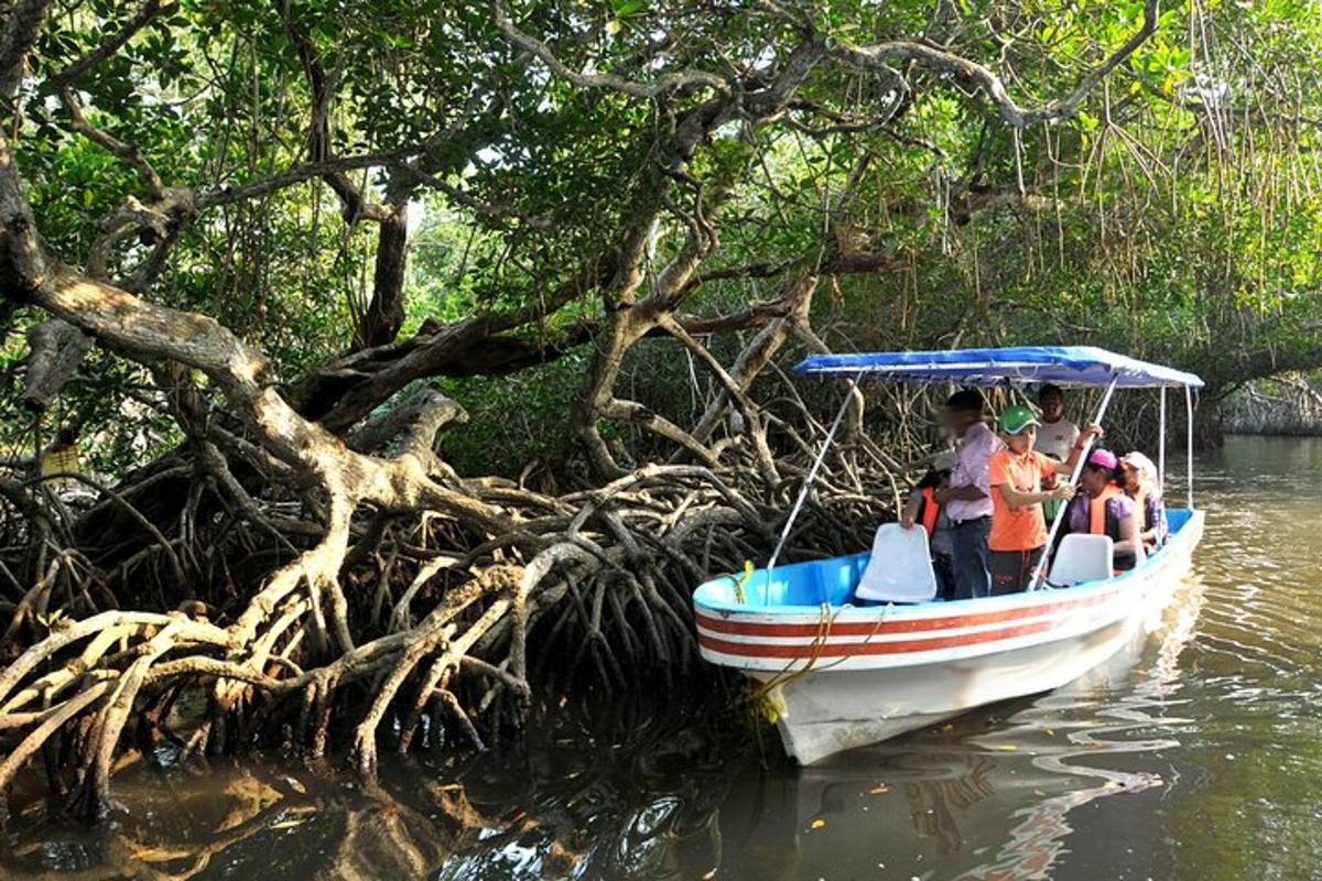 a group of people on a boat in the water