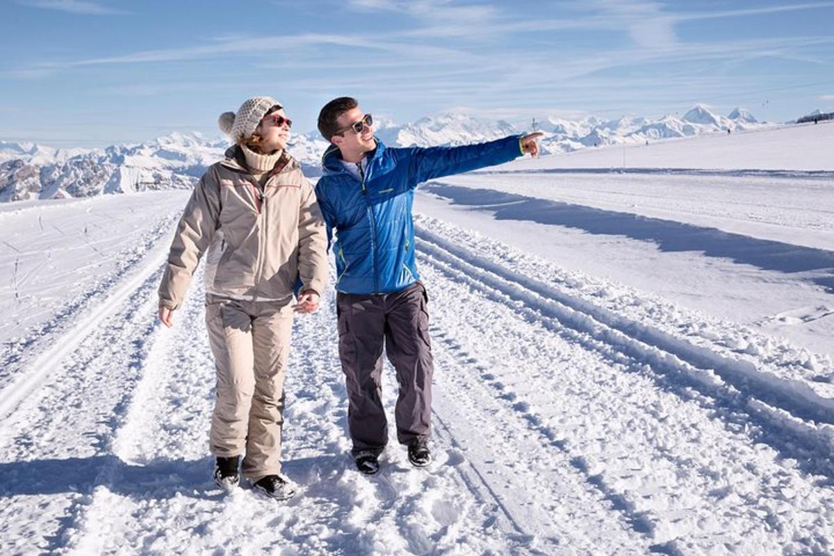 a man and a woman standing in the snow