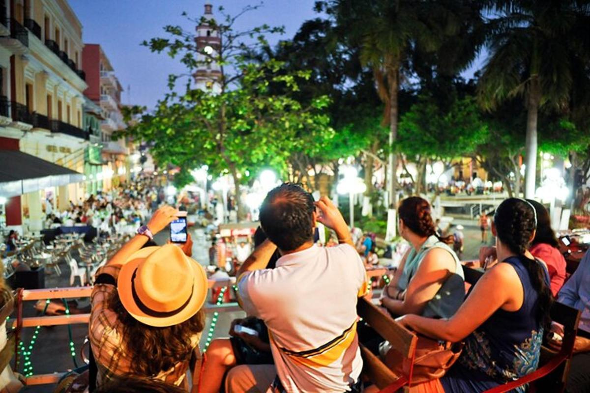 a group of people sitting on benches taking pictures of a parade