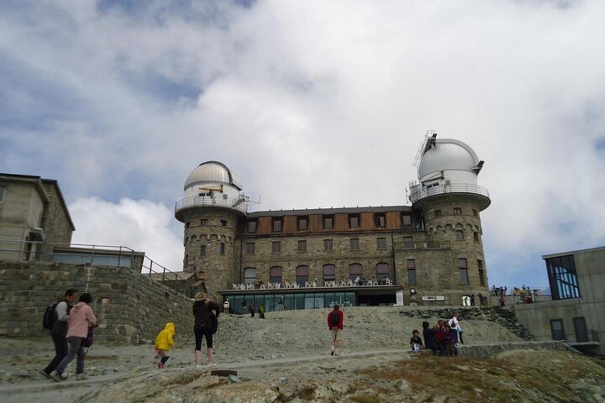 a castle with people standing in front of it