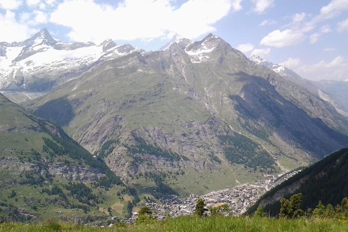 a mountain view of a town in a valley