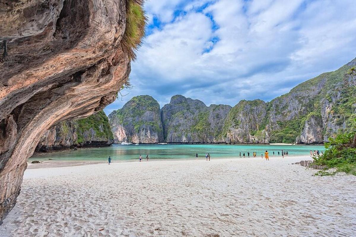 a view of a beach with people in the water