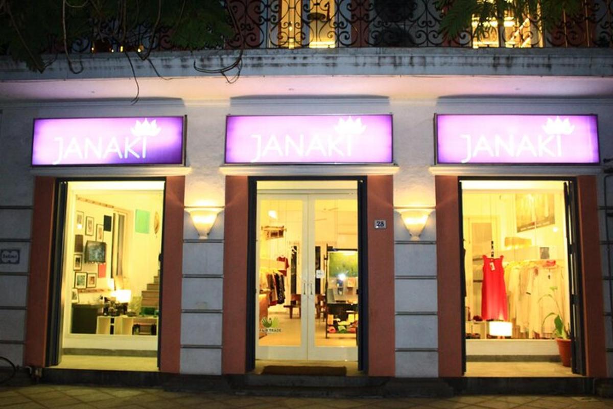 a store front with purple neon signs in front