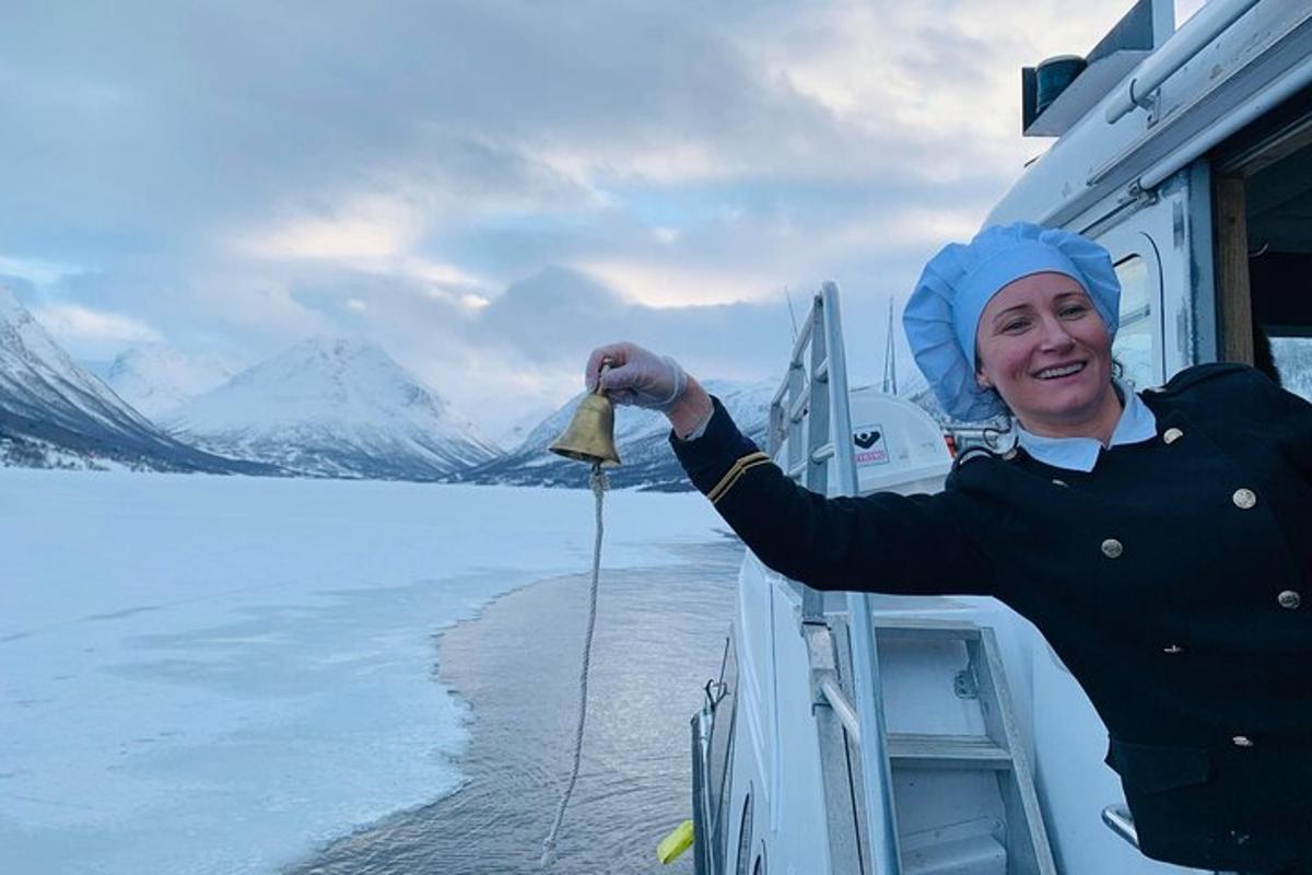 a woman on a boat holding a piece of food