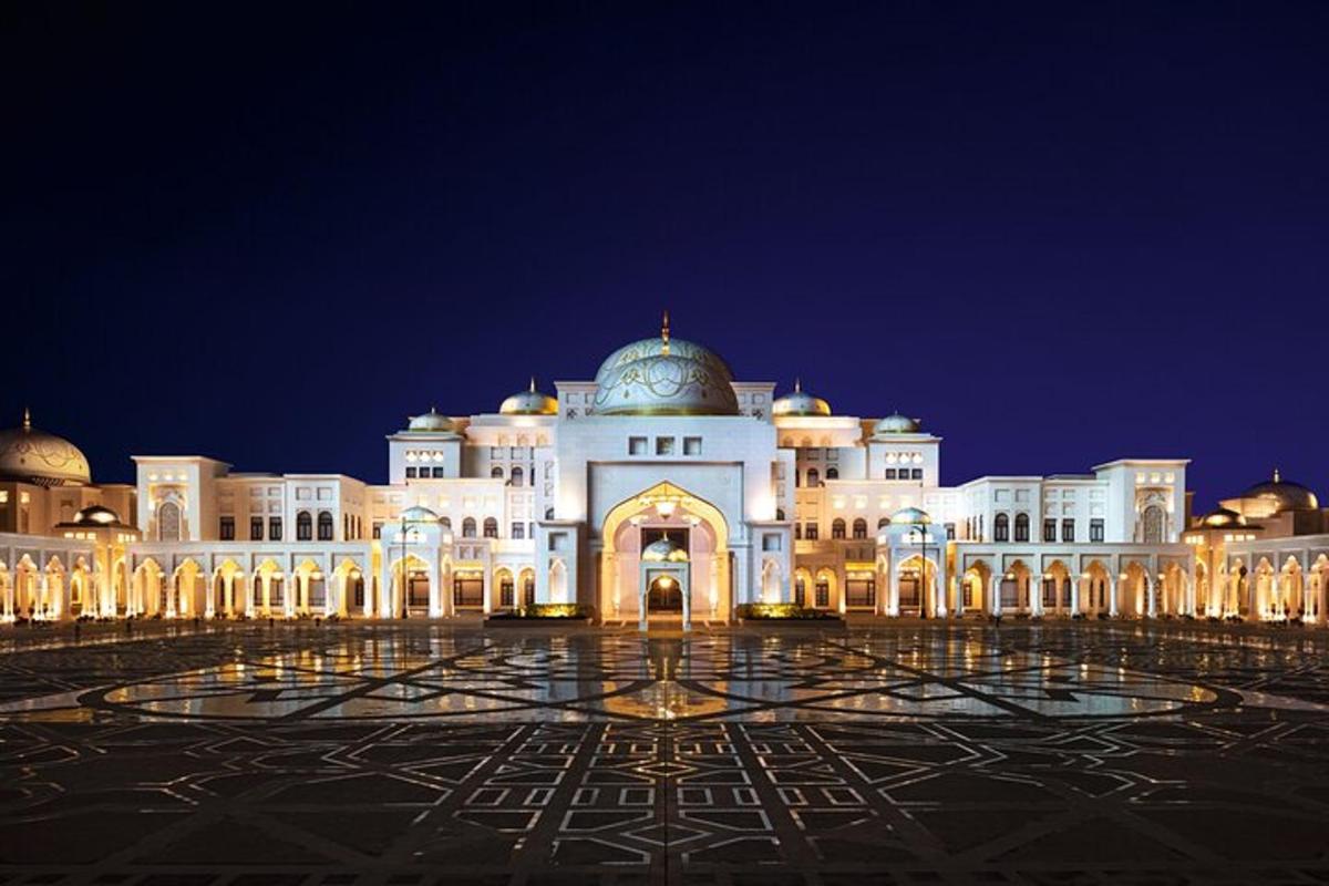 a large white building with a dome on top at night