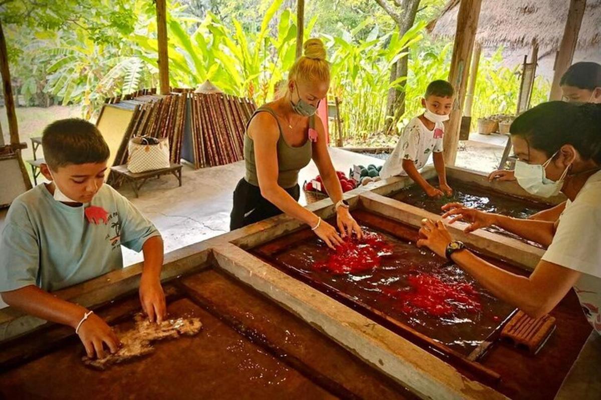 a group of people preparing food in a trough