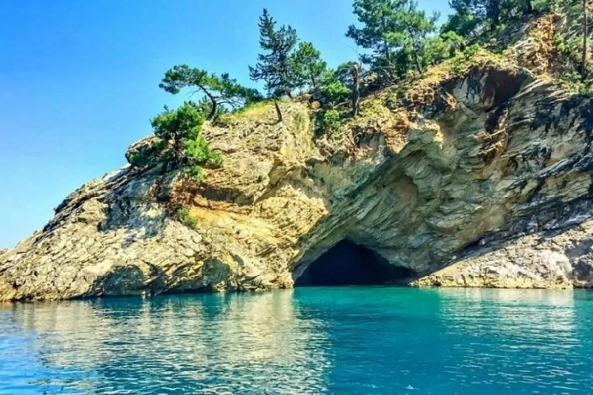 a cave in the side of a rocky cliff