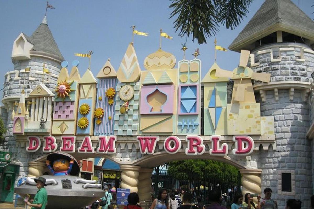 a disney world sign in front of a castle