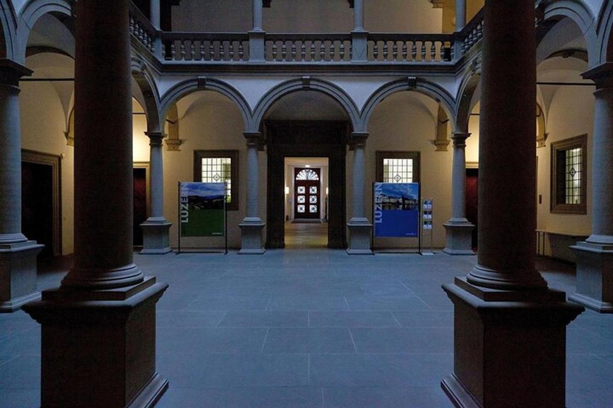 an empty room with columns in a building