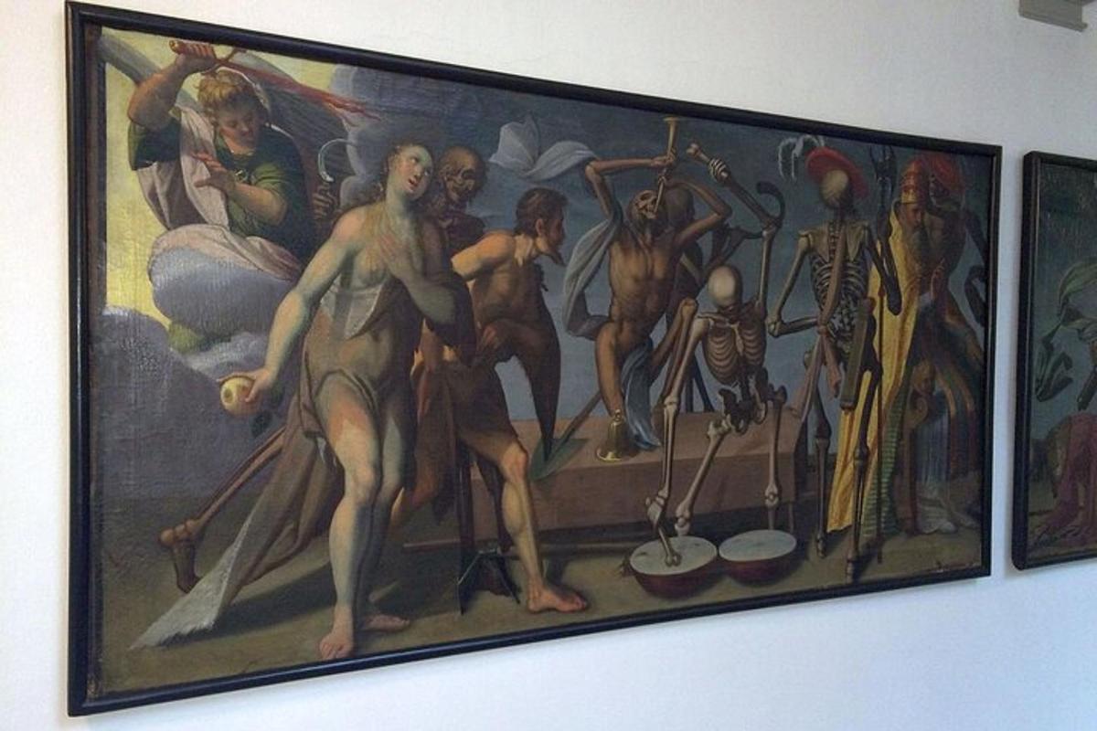 a painting of a group of people on a wall