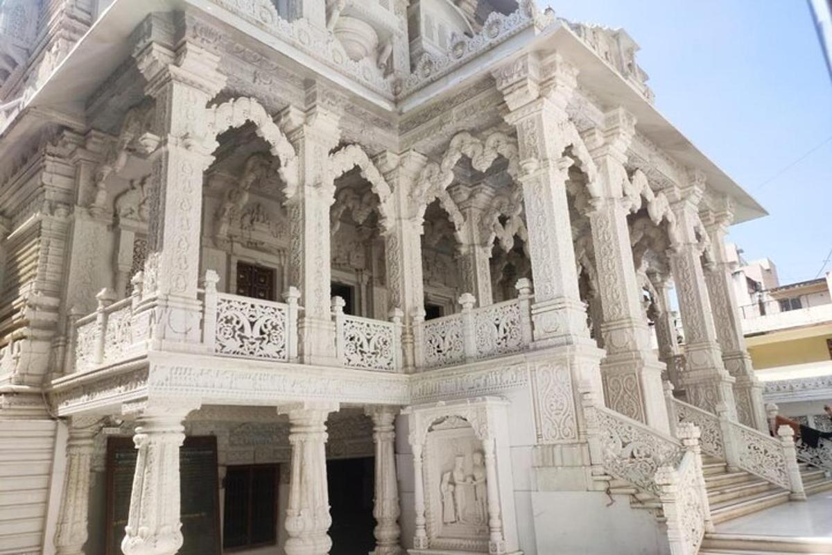 a large white building with a balcony