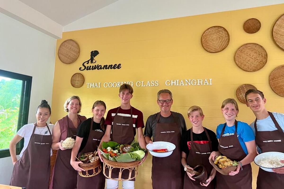 a group of people in aprons holding a basket of food