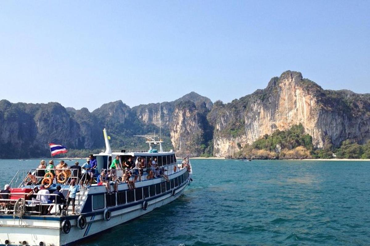 a group of people on a boat in the water
