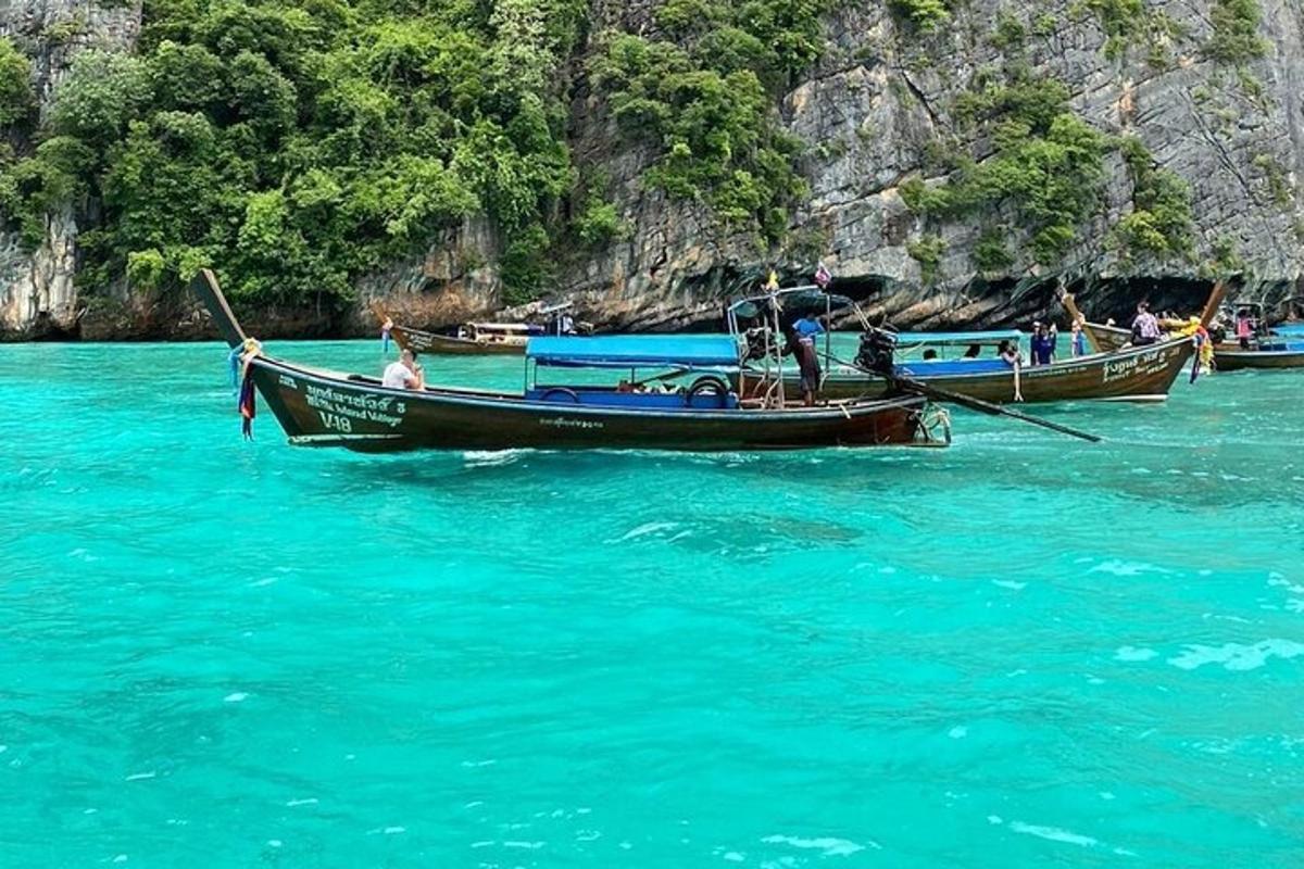 two boats in the water with people on them