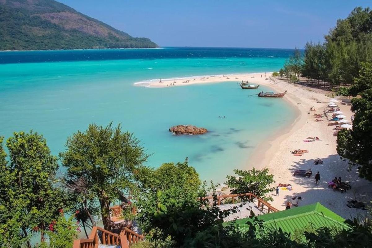 a view of a beach with people in the water