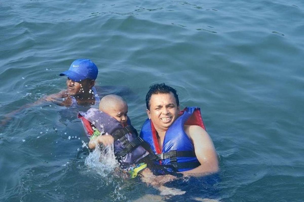 a group of three people in the water