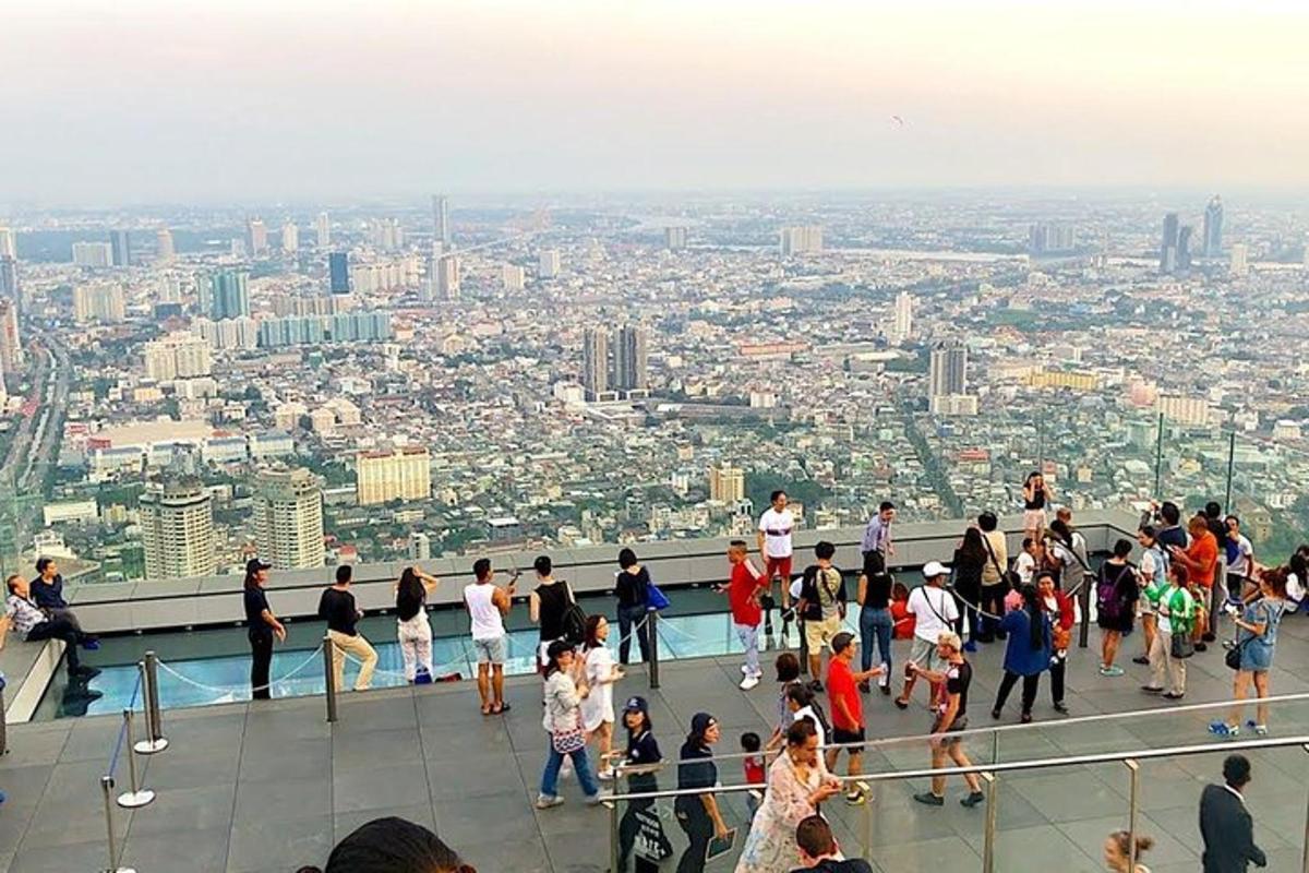 a group of people standing on the top of a building