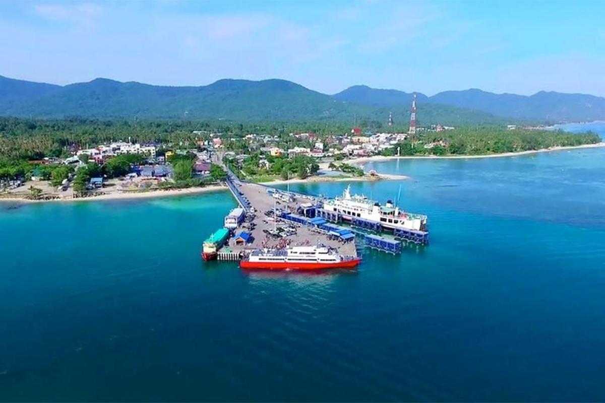 two boats are docked in a large body of water